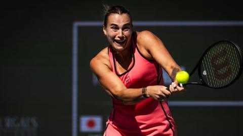 Aryna Sabalenka with a back hand against Naomi Osaka