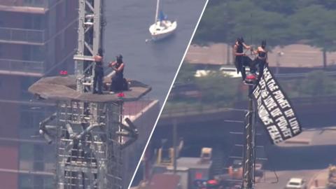 Split image of two people who scaled the Empire State Building getting engaged at the very top (left), waving a black banner with white writing (right)