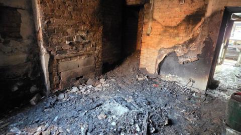 Inside of a house in Lancaster Street, Leicester, that was damaged by a fire. The blaze has destroyed all of the families belongings.