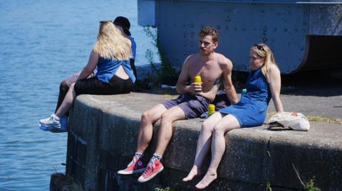 People enjoy the hot weather in Bristol, as the third heatwave of the summer hits the UK. Picture date: Sunday July 13, 2025.