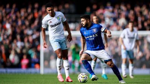 Sam Morsy controls the ball against Aston Villa