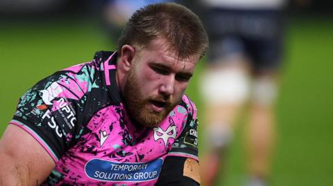 Garyn Phillips recovers from a collision