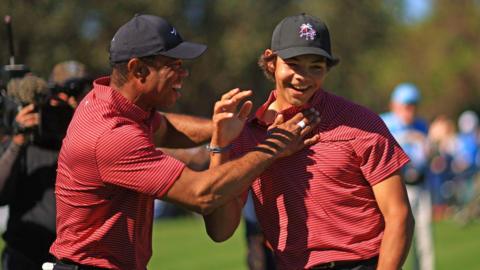 Tiger Woods of the United States reacts with his son Charlie Woods after making the first hole-in-one of his career