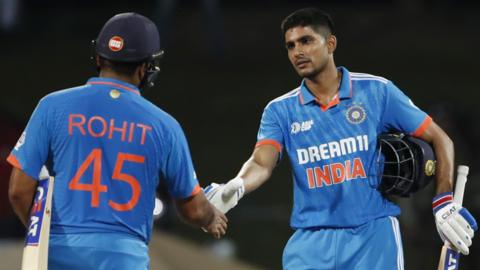 Rohit Sharma captain of India (L) and Shubman Gill of India (R) shake hands