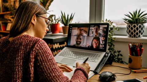 Stock image of woman working from home