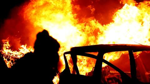 A car on fire in west Belfast