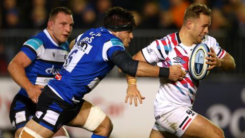 James Williams (right) runs with the ball as Josh Bayliss tries to tackle him