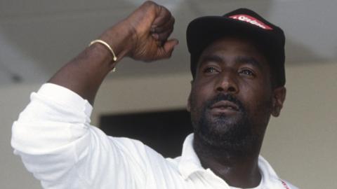 West Indies legend Sir Viv Richards raises a fist in celebration after beating England in a Test series