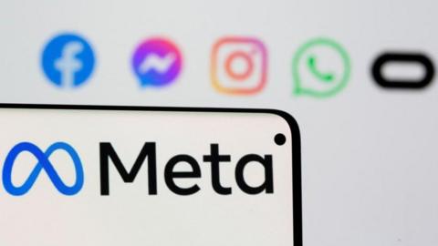 Facebook's new rebrand logo Meta is seen on smartpone in front of displayed logo of Facebook, Messenger, Intagram, Whatsapp and Oculus in this illustration picture taken October 28, 2021