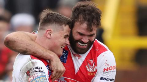 Jack Welsby (left) scored two tries on his 100th appearance for St Helens
