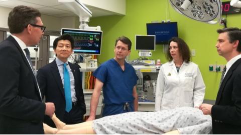 Dr Andrew Lee and other members of the surgical team