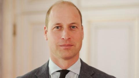 The Prince of Wales wearing a suit and tie