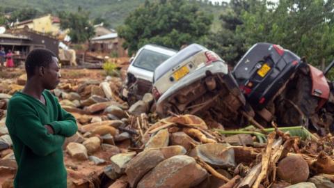 A man overlooks wreckage caused by the flooding