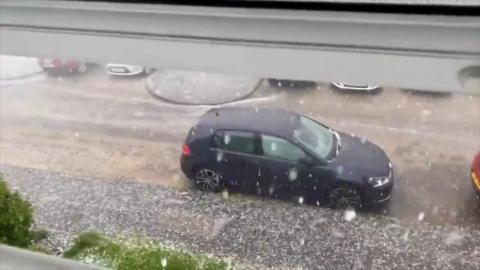 Hail falling on a car