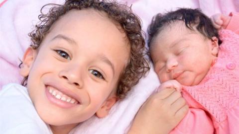 Alexander, 5, looking delighted to meet his day-old sister Miya born in October in Hertfordshire