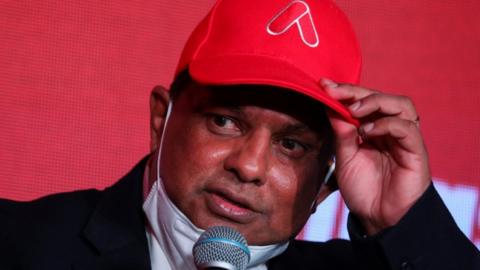 Tony Fernandes delivers a speech during a ceremony announcing a name change of the group holding company from AirAsia Group Berhad, in Kuala Lumpur, Malaysia.