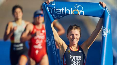 Britain's Beth Potter celebrates winning the Triathlon World Cup event in Valencia