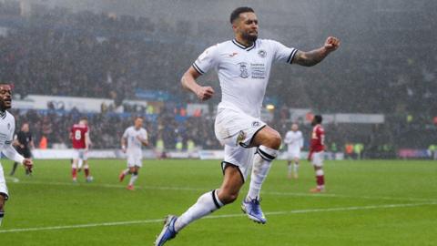 Cyrus Christie of Swansea City celebrates