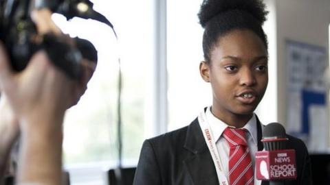 School Reporter from Robert Clack School practices in front of camera