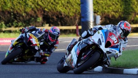 Alastair Seeley leads Davey Todd during a Superstock race at the 2023 North West 200