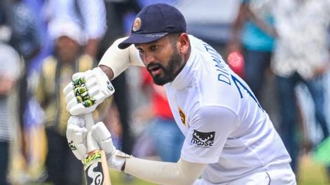 Sri Lanka's Dimuth Karunaratne plays a shot