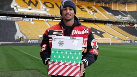 Ben Whittaker with shoeboxes at Molineux