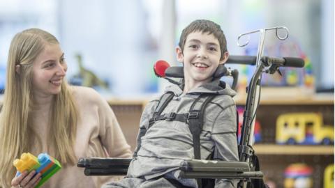 Disabled boy in wheelchair