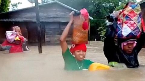 Woman in flood waters
