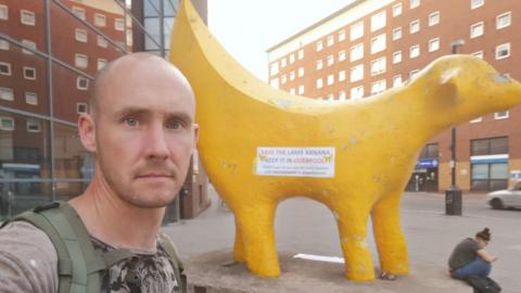 Paul Curtis at the Super Lambanana sculpture