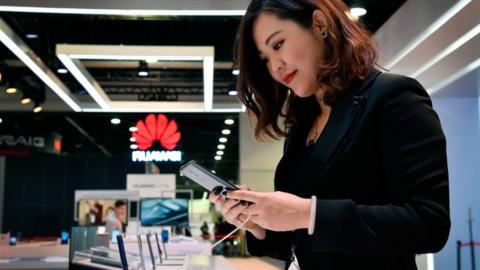 Woman using Huawei phone