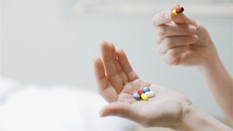 Person holding tablets in their hands