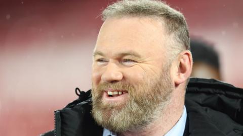 Wayne Rooney laughs as he arrives at Nottingham Forest v Manchester United