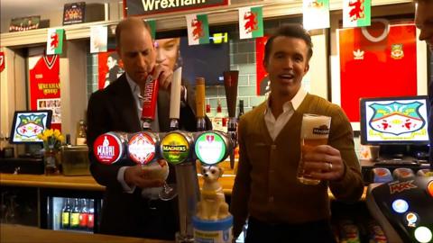 Prince William behind a bar with Rob McElhenney