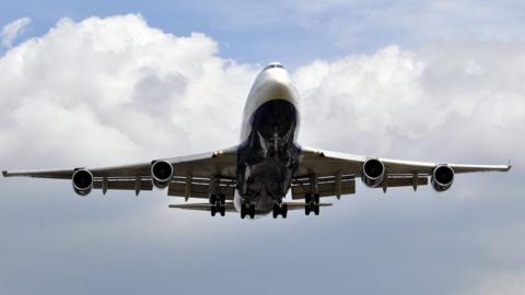 Plane coming into land at Heathrow Airport