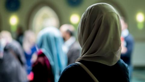 Muslim women stand in the Aya Sofya mosque