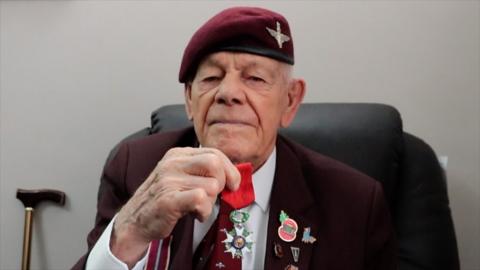 Leonard holding his Legion d'Honneur medal