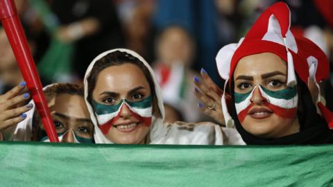 Female Iranian football fans attend a screening of a 2018 World Cup match at the Azadi Stadium in Tehran
