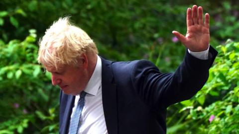 Boris Johnson waving