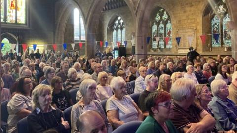 People at a meeting in Kettering