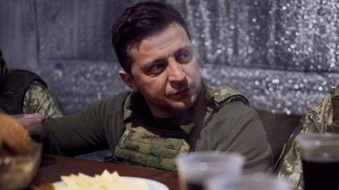 Ukrainian President Volodymyr Zelenskiy meets with service members of the country"s armed forces at combat positions near the line of separation from Russian-backed rebels in the Donetsk region