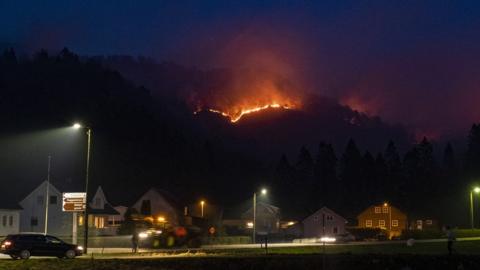 A forest fire is seen outside the village Sokndal, Norway, 23 April 2019