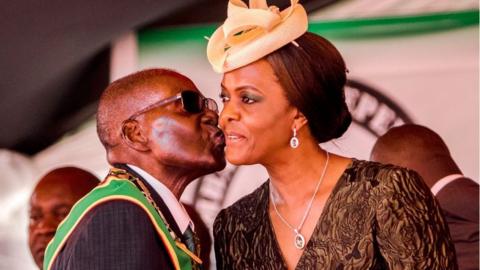 President Robert Mugabe kisses his wife and first lady Grace Mugabe during during the country's 37th Independence Day celebrations at the National Sports Stadium in Harare April 18, 2017.