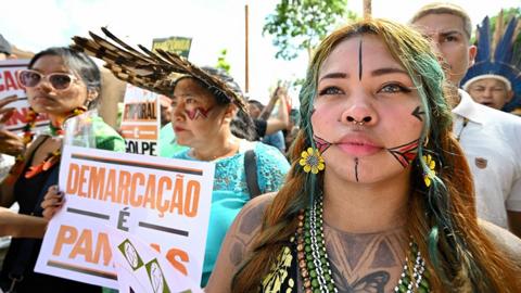 Indigenous people from Amazon countries and members of social movements take part in the March of the Peoples of the Earth for the Amazon in Belém, Para State, Brazil, on August 8, 2023.