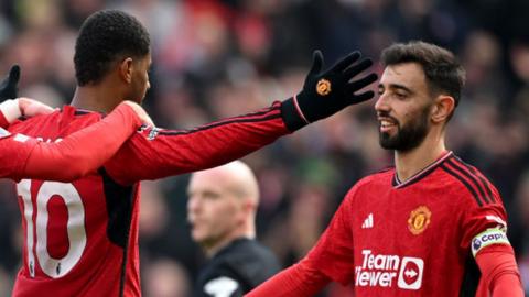 Marcus Rashford celebrates with Bruno Fernandes after scoring for Manchester United against Everton at Old Trafford