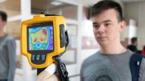 Checking students' body temperature with thermal imaging cameras at the entrance to Ryazan State Radio Engineering University during the COVID-19 coronavirus pandemic.