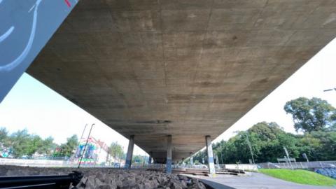 A motorway bridge that is crumbling