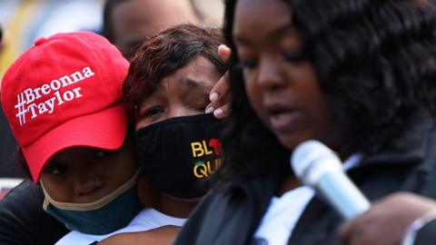 Breonna Taylor's mother Tamika Palmer cries as her sister Bianca Austin speaks