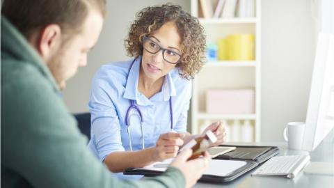 Doctor with patient (stock image)