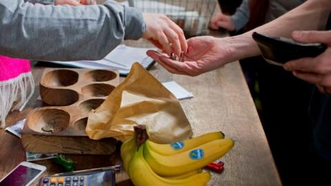 Person buying bananas