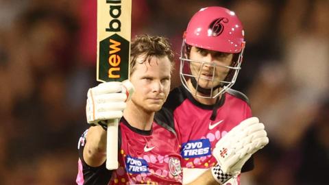 Sydney Sixers' Steve Smith celebrates reaching his century against Adelaide Strikers in the Big Bash